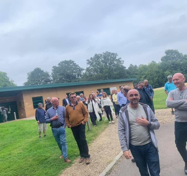 men stood by a reception